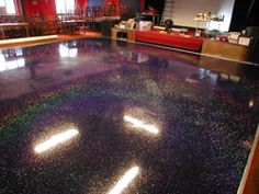 the floor is shiny and there are no people in the room to sit on or stand up