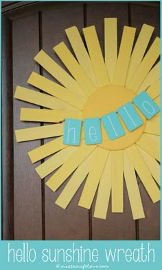 the word hello written in cut out letters on a sunburst made from construction paper