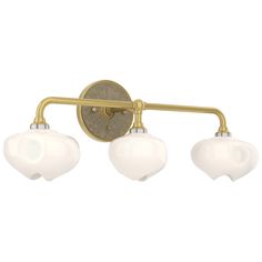 three light bathroom fixture in an antique brass finish with frosted glass shades on the bulbs