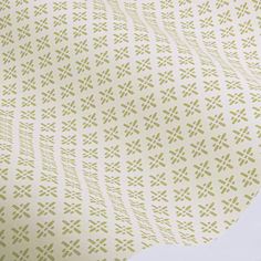 an image of a white and green wallpaper with small designs on it's surface