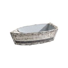 an old metal tub with blue and white stripes on the bottom, sitting in front of a white background