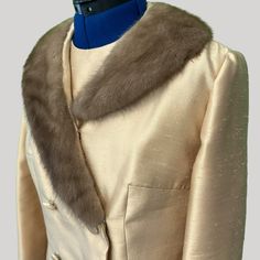 "This luxurious sheath dress with coordinating fur collar coat was designed by Bernetto, New York and sold by the Nebraska, Omaha boutique.  The sleeveless dress is fully lined and measures 27\" from underarm to hem, 36\" bust, 34\" waist, and 37\" hip. It features ecru lace insets and a 21\" back zipper. The coat fits over the dress and features a light brown (mink?) collar and fabric-covered buttons. Dress and coat are in excellent pre-owned condition and have excellent tailoring. The color is more striking in the picture with a goldish sheen." Elegant Mink Outerwear For Party, Elegant Formal Outerwear With Faux Fur Trim, Coat With Fur Collar, Coat Fits, Coat With Fur, Fur Collar Coat, Collar Coat, Fabric Covered Button, Lace Inset