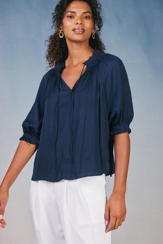 With its flowy shape and sweetly tied neckline, this short-sleeve pleated top is just the right piece for creating effortlessly chic looks. It's softly textured and floats elegantly on the figure, drawn in by delicate ruffle trim. •On average, customers say it fits large •Relaxed fit •Pullover styling •V-neck with tie detail •Raw cut hem DIMENSIONS •Standard: 24" L Item number 1631138100% Polyester Dry clean Imported Spring Short Sleeve Blouse With Gathered Neckline, Summer Solid Blouse With Crinkle Texture, Spring Blouse With Gathered Neckline And Short Sleeves, Chic Short Sleeve Tops With Gathered Neckline, Chic Blouse With Gathered Neckline And Short Sleeves, Chic Short Sleeve Blouse With Gathered Neckline, Casual Blouse With Gathered Neckline And Short Sleeves, Casual Short Sleeve Blouse With Gathered Neckline, Casual Tops With Gathered Neckline And Short Sleeves