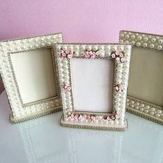 three frames decorated with flowers and pearls