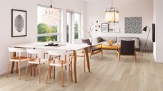 an open concept living and dining room with wood floors, white walls, and large windows