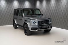 the mercedes g - class is on display at the luxury car show