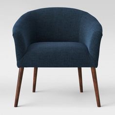 an upholstered blue chair with wooden legs