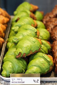 there are many different types of pastries on display