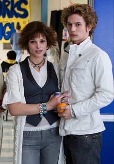 two young people standing next to each other