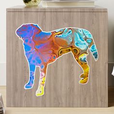 an image of a colorful dog on a cabinet