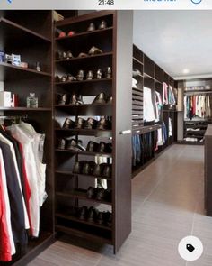 a walk in closet filled with lots of shoes and clothing on shelves next to each other