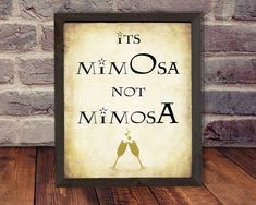 a sign that says it's mimosa not mimosa on the wall