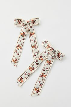 Set of two hair bows in floral jacquard set on secure barrette backings. Features Jacquard floral hair Bow barrette set Set of two coordinating hair bows Jacquard floral pattern Content + Care Set of 2 Mixed metal, textile Spot clean Imported | Jacquard Floral Hair Bow Barrette Set in Cream, Women's at Urban Outfitters Embroidered Hair Bow, Cute Barrettes, Floral Hair Accessories, Embroidered Hair Bows, Bow Barrette, Floral Accessories Hair, Floral Jacquard, Floral Hair, Gift List