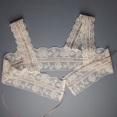 An antique filet lace camisole yoke, unused and in perfect condition.  The lace has been threaded with a new dusky rose coloured ribbon. Laid flat and open the yoke is 91 cm [36 cm]  wide and  25 cm [10"]deep. [Top of the shoulder strap to the bottom of the lace.] The lace is suitable for topping a chemise, nightgown or even a light summer dress. The lace is soft white in colour. Any excess postage on multiple orders will be refunded in full.       Antique and vintage items will rarely be perfec Chemise Nightgown, Filet Lace, Light Summer Dresses, Lace Chemise, Summer Wines, Lace Outfit, Linens And Lace, Lace Straps, Lingerie Sets