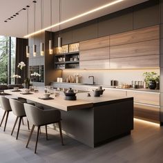 a modern kitchen with an island and dining table