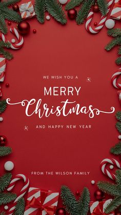 a red and white christmas card with candy canes in the middle, surrounded by evergreen branches