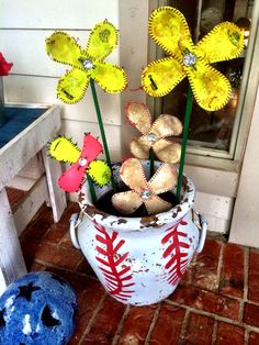 a baseball themed vase with flowers in it