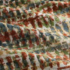 a close up view of a multicolored blanket