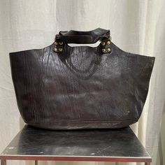 Made In Italy, Brown Leather, Comes With Longer Strap, Care Bag And Leather Cream 15 X 10 X 3 Inches Two Zipper Pockets Inside Brown Shoulder Bag With Gunmetal Hardware For Shopping, Chic Black Satchel With Brass Hardware, Black Travel Bag With Brass Hardware, Black Shoulder Bag With Brass Hardware, Chic Black Shoulder Bag With Leather Backing, Black Rectangular Bag With Brass Hardware, Chic Black Bag With Brass Hardware, Chic Black Bags With Brass Hardware, Chic Satchel With Brass Hardware