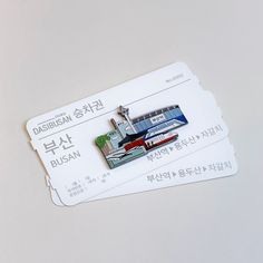 two luggage tags with an image of a ship on them