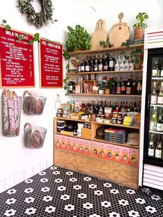 a store filled with lots of different types of food and drinks on shelves next to each other