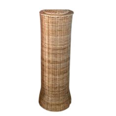 a tall vase made out of wicker is shown on a white background with the bottom half