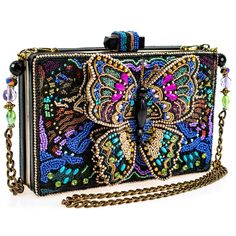 A true kaleidoscope of colors and textures take flight in this handbag. Detailed hand-beaded workmanship bring the artistic vision of this bag to life. A 3-dimensional beaded butterfly centerpiece ties the whole style together! Elegant Multicolor Beaded Bag, Multicolor Beaded Rectangular Evening Bag, Embellished Multicolor Rectangular Shoulder Bag, Multicolor Embellished Rectangular Shoulder Bag, Multicolor Beaded Evening Bag, Embellished Multicolor Evening Bag, Multicolor Embellished Handheld Evening Bag, Embellished Multicolor Evening Bag As Gift, Multicolor Embellished Evening Bag As Gift