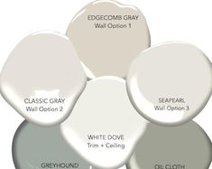 four different shades of gray paint with white and grey colors in the same color scheme