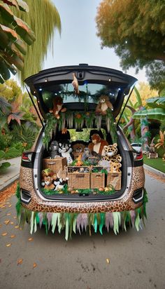 the trunk of a car is decorated with animal decorations