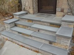 a set of stone steps leading up to a door