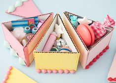 an open box filled with assorted items on top of a blue table next to other objects