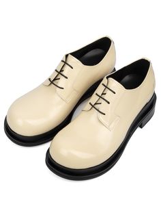 Editor's NotesSO.U:LESURES’s derby shoes give casual and minimal look with round toe style and bold outsole.- Lace-up design- Round toe style- Bold outsole- Logo lettering print in insole and under outsole- Minimal designMeasurements(in.)- Size: KR220mm(US4) - KR300mm(US12)- Heel Height: 2.4in.- Fits true to the sizeComposition & Care- 100% Leather- Please check the care labelDesigner- by SO.U:LESURES Modern Patent Leather Lace-up Shoes For Derby, Modern Lace-up Flat Shoes With Rubber Sole, Modern Lace-up Shoes With Rubber Sole And Flat Heel, Modern Low-top Oxfords With Lug Sole, Modern Lace-up Shoes For Derby With Almond Toe, Modern Lace-up Shoes With Almond Toe For Derby, Derby Lace-up Shoes With Round Toe And Lug Sole, Modern Plain Toe Oxfords For Spring, Modern Oxfords With Lug Sole