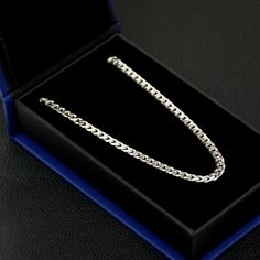 Discover timeless elegance with our Cuban Link Silver Chain, meticulously crafted in Italy. Made from high-quality sterling silver with a durable 925 coating of rhodium, this chain is designed to withstand the test of time while maintaining a brilliant shine. Its 5mm thickness adds the perfect weight, offering a subtle statement piece suitable for any occasion. The luxurious sheen of rhodium not only enhances the chain's appeal but also provides resistance to tarnishing and oxidation, ensuring i Luxury Sterling Silver Jubilee Bracelet With Chain Link, Stainless Steel Cuban Link Silver Chain, Stainless Steel Cuban Link Silver Chain Necklace, Luxury Sterling Silver Chain Link Jubilee Bracelet, Luxury Sterling Silver Chain Bracelet, Tarnish Resistant, Loose Stones, Cuban Link, Polish Jewelry, Sterling Silver Chains