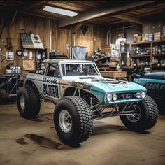 a monster truck is parked in a garage