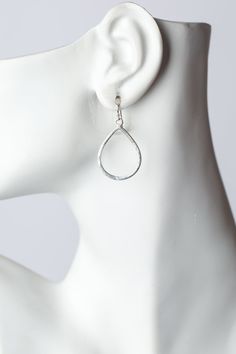 The brushed silver findings in a simple teardrop design. They are created with brushed silver plated brass, and dangle at approximately 1.5" from sterling silver ear wires. Silver Plated Brass (nickel and lead-safe) 1.5", with sterling silver ear wires We hand select our natural materials, thus there may be slight variations in color and/or size that will not detract from the overall aesthetic Our unique handcrafted designer jewelry for women is made in America, each design created individually Everyday Metal Teardrop Earrings, Modern Nickel-free Dangle Teardrop Earrings, Hypoallergenic Metal Drop Teardrop Earrings, Hypoallergenic Metal Teardrop Drop Earrings, Hypoallergenic Metal Teardrop Earrings, Silver Metal Teardrop Earrings For Everyday, Silver Nickel-free Teardrop Earrings For Everyday, Silver Teardrop Hoop Earrings With French Hook, Nickel-free Silver Teardrop Earrings For Everyday