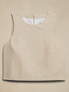 LINEN-BLEND: This light and breathable fabric is a must for those warm days and styles effortlessly for all occasions. Last year's bestseller, now with an updated back detail! Crafted from stretch linen, this piece is sophisticated and tailored while remaining incredibly versatile. Pair it with shorts or pants for a polished look. Crew neck. Sleeveless. Keyhole opening with button back closure. Straight hem with center back slit. Fully lined. Made exclusively for Banana Republic Factory. #888907 Banana Republic Factory, Polished Look, Linen Blend, Breathable Fabric, Best Sellers, Banana Republic, Crew Neck, Sewing, T Shirts