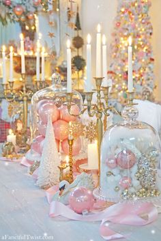 a table topped with lots of candles and ornaments