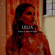 a woman standing in front of a window with the words leila on her face