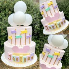 a three tiered cake with balloons and decorations on the top is pink, purple, yellow and white