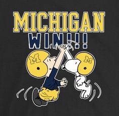 a black shirt with the words michigan winy and a cartoon image of a football player