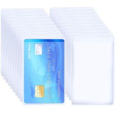 a group of white credit cards sitting next to each other