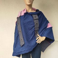 Upcycled Denim Patchwork Poncho Knitted patchwork Black and blue denim patchwork recycled poncho coat hippie boho style Upcycled denim patchwork poncho with frayed seams.  Black and blue patchwork  denim recycled poncho coat.  Fall/winter coat.   Hippie boho style. Unique design. One of a kind. The poncho is a standard size and fits all. Length front and back neckline - 90 cm Length in front from the shoulder - 102 cm Sleeve length 60 cm. If you have any questions, or you want to order any color Bohemian Denim Blue Patchwork Outerwear, Denim Poncho, Patchwork Poncho, Knitted Patchwork, Fall Winter Coat, Poncho Coat, Ladies Poncho, Patchwork Denim, Upcycled Denim