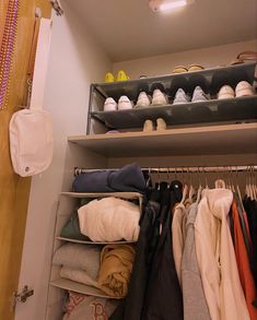 a closet filled with lots of clothes and shoes