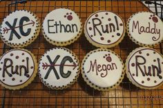 decorated cookies on a cooling rack with names