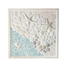 a tile with shells and starfishs on it