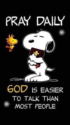 a black shirt with a cartoon dog saying pray daily god is easier to talk than most people