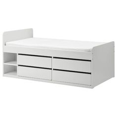 a white bench with two drawers on it