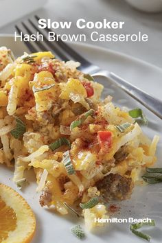 the cover of slow cooker hash browns casserole on a plate with orange slices