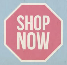 a pink stop sign with the words shop now written on it in white letters against a blue background