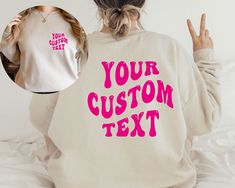 Create a unique and personal style with our Custom Front and Back Text Font Sweatshirt. This personalized unisex text shirt allows you to add your own message on both the front and back, using your choice of font. The pullover crewneck hoodie design adds comfort and style, making it an ideal custom sweater for Valentine's Day or any special occasion. It's a thoughtful and bespoke gift for your loved ones. ✨ K E Y * D E T A I L S ✨ Colors may vary slightly due to fabric and screen differences. 🌈 Custom Text Sweatshirt With Relaxed Fit For Fall, Custom Text Long Sleeve Relaxed Fit Sweatshirt, Custom Text Relaxed Fit Long Sleeve Sweatshirt, Casual Crew Neck Hoodie With Custom Text, Casual Cotton Hoodie With Custom Text, Custom Text Long Sleeve Sweatshirt For Streetwear, Custom Text Long Sleeve Tops For Streetwear, Customized Long Sleeve Sweatshirt With Graphic Print, Custom Text Long Sleeve Sweatshirt